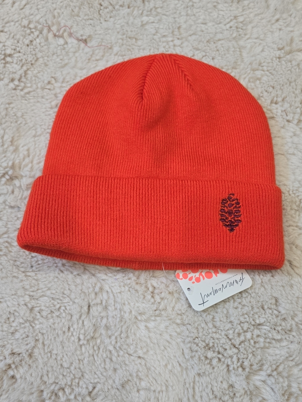 FP Movement by Free People Bright Orange Knit Beanie with Pinecone Detail